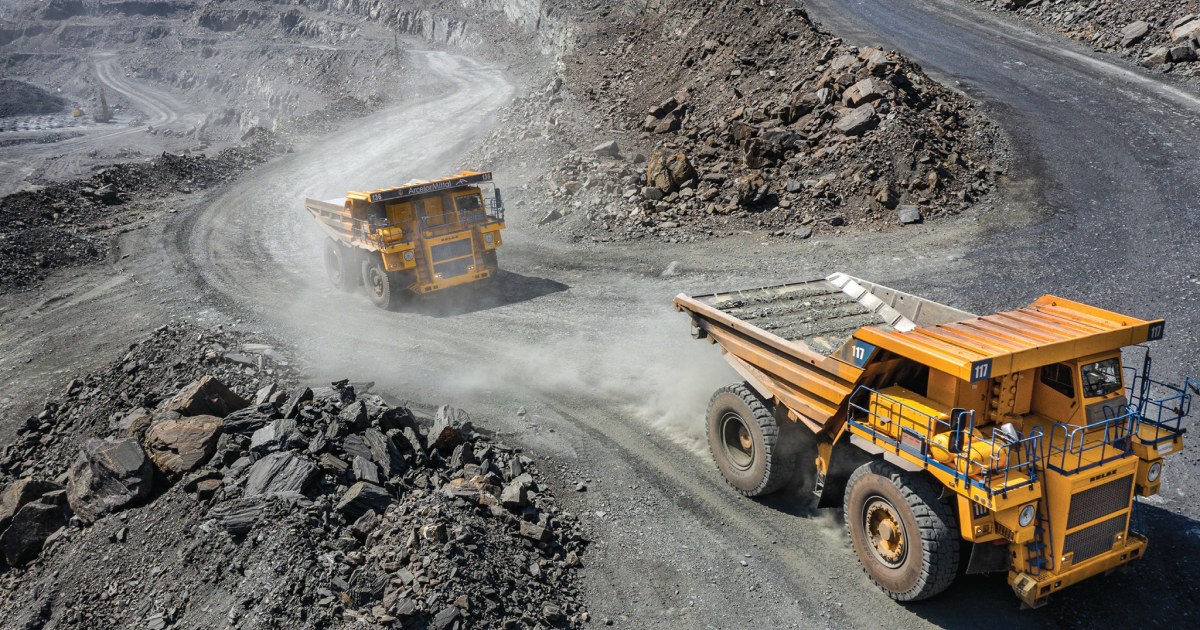 Mining dump trucks operating in an open pit